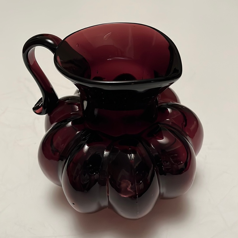 Deep red color small glass pitcher